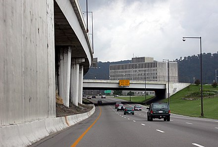 Interstate 64 and Interstate 77 at the WV 114 three-level interchange in Charleston, West Virginia. The westbound/northbound lanes are to the left, cantalivered at times, over the eastbound/southbound lanes. Interstate64 and 77 in Charleston.jpg