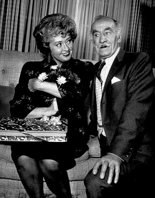 Clyde as George MacMichael, charmed by Joan Blondell as the McCoys' Aunt Win