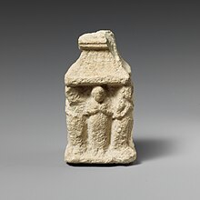 A complex Cypriot figure exhibiting pose Limestone naiskos with female figures holding their breasts MET DP159451.jpg
