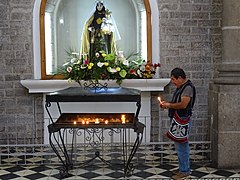 Man with Votive Candle - Cathedral - Quetzaltenango (Xela) - Guatemala (15960567791).jpg