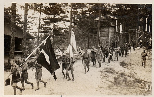 Members of the Latvian Scout and Guide Central Organization carrying flag of Latvia in Jūrmala in 1934