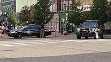 OCSO deputy and patrol cars in downtown Pontiac Oakland County Sheriff's Office, Downtown Pontiac, 2022.jpg