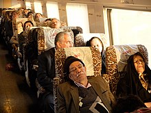 Passengers on board a train from Yazd to Tehran watch movies and sleep, 2014 Onboard.jpg