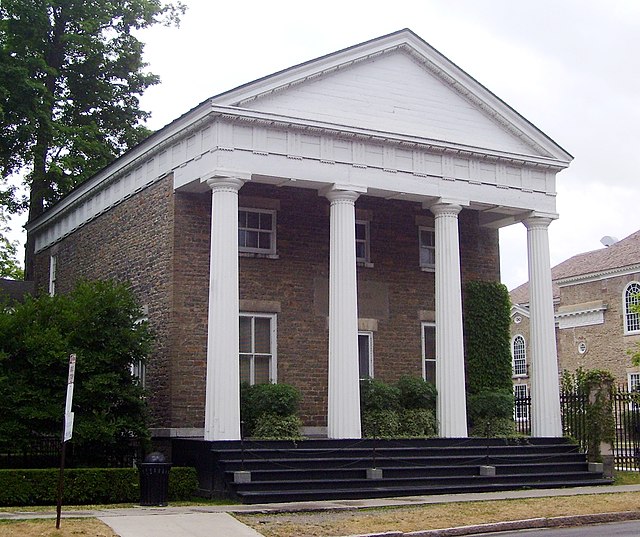 The Clark Estates building, originally the Otsego County Bank, was built in 1831 in the Greek Revival style