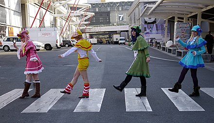 In 2011, four cosplayers imitate the above scene (a meme) during the Manga convention Paris Manga 2012 at a zebra crossing in Paris
