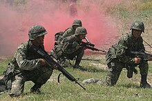 Philippine Marines 8th Marine Battalion Landing Team, push forward after splashing ashore in an amphibious assault vehicle during an amphibious assault training exercise Philippine Marines with 28th Company 8th Marine Battalion Landing Team.jpg