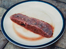 A slice of placenta, being prepared for consumption. PlacentaSlice.jpg