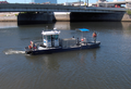 The Vine Street Expressway Bridge, with the Philadelphia Water Department's river cleaning work boat R.E. Roy in the foreground.