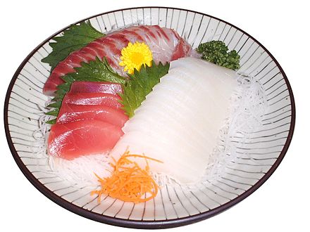 Most fish is cooked, but sashimi is eaten raw; pictured: red: maguro (tuna); white: ika (cuttlefish); red and white combination: tai (sea bream)