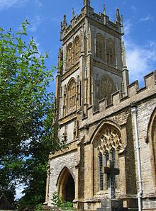 Stone building with arched windows and square tower.