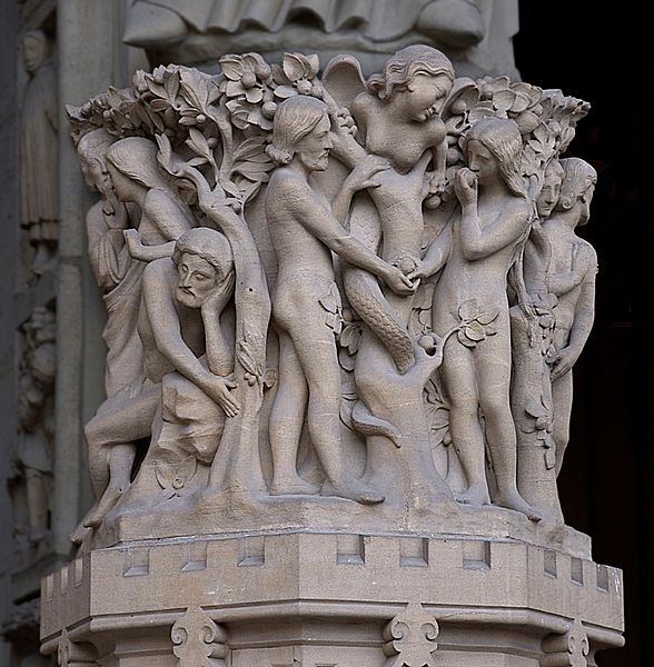 Adam, Eve, and a female serpent at the entrance to Notre Dame Cathedral in Paris, France. The portrayal of the image of the serpent as a mirror of Eve