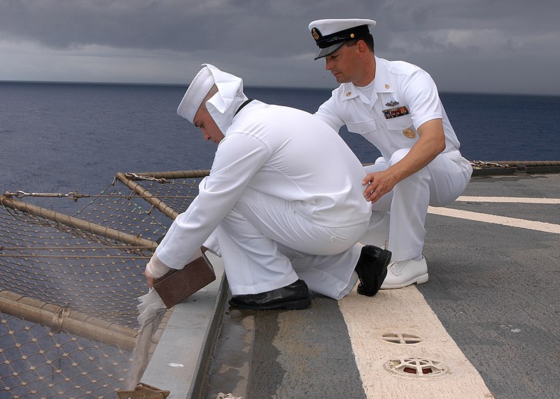 File:US Navy 050520-N-9860Y-034 Chief Master-at-Arms William A. Holloway, of Ocala, Fla., assists Hull Technician 3rd Class James C. Harrod, of Westminster, Md., while releasing the cremains of a retired Navy veteran during a U.S. N.jpg