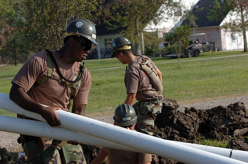 File:US Navy 050928-N-2653P-007 Seabees from Naval Mobile Construction Battalion Four Zero (NMCB-40) prepare to install sewage pipes for an evacuee relocation trailer site.jpg