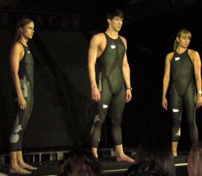 Michael Phelps (centre) unveils the Speedo LZR Racer suit.