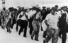 Wake POWs in 1941 Wake civilian contractors marching in captivity 1941.jpg