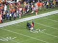 English: Security drags a person who ran on the field at the 2019 College Football Playoff National Championship.