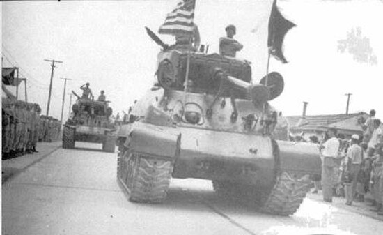 Elements of the 206th Heavy Tank Battalion pass in review during Annual Training 1950.