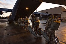 Airmen assigned to the 820th Base Defense Group load on to an HC-130J Combat King II before an airborne jump for Mosaic Tiger Feb. 22, 2021, at Moody Air Force Base, Georgia. Airborne infiltration operations established airfield security and safe arrival of follow-on forces for Mosaic Tiger. Mosaic Tiger is designed to test the 23d Wing's ability to integrate multi-capable Airmen into joint operations while maintaining a lighter footprint downrange. 210222-F-WE075-1047.jpg