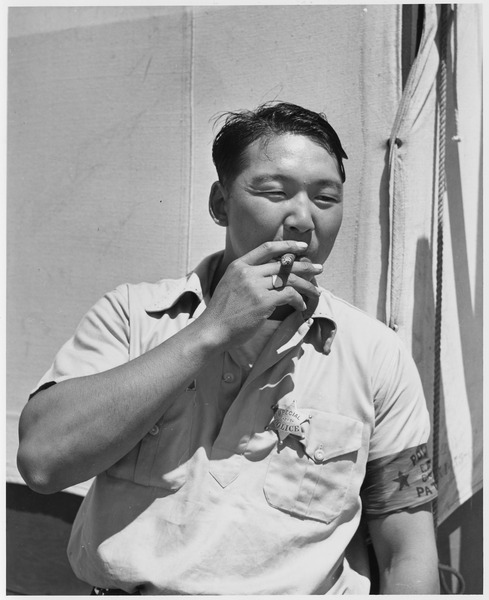 File:A Japanese man smoking a cigar during Relocation - NARA - 195541.tif
