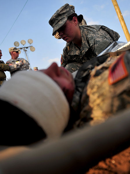 File:A U.S. Army medic, top, treats a fellow Soldier during an emergency response exercise as part of Austere Challenge 2012 in Beit Ezra, Israel 121022-F-QW942-104.jpg