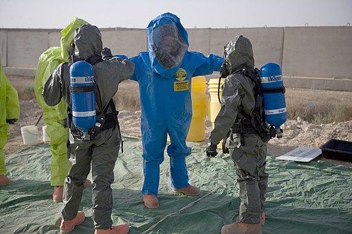 A U.S. Marine goes through a decontamination station during an anti-terrorist force protection drill conducted by the Marine Air Group (MAG) 26 chemical, biological, radiological and nuclear department 090519-M-CY203-041