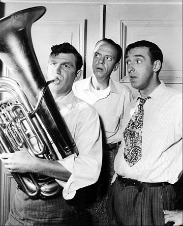 Andy does his part for the Mayberry town band.  Barney and Gomer are not sure he's helping the cause.