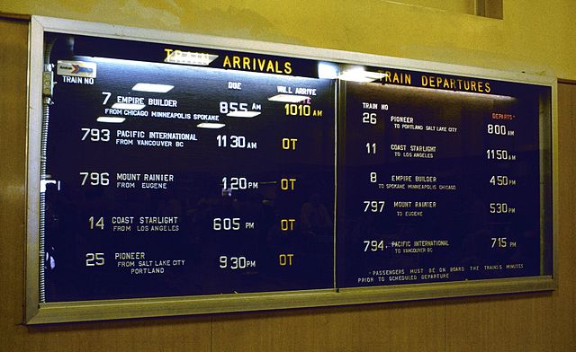 Departure board at Seattle's King Street Station in 1981, listing the Mount Rainier, the Pacific International, and other since-discontinued trains