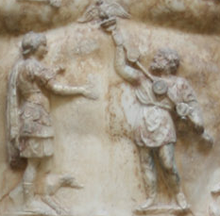 A close-up view of the breastplate on the statue of Augustus of Prima Porta, showing a Parthian man returning to Augustus the legionary standards lost by Marcus Licinius Crassus at Carrhae Augustus Prima Porta (detail).PNG
