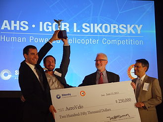 AHS International announced AeroVelo as the winner of its Igor I. Sikorsky Human Powered Helicopter Competition on July 11, 2013. Left to right: Cameron Robertson and Todd Reichert, AeroVelo; Mark Miller, Sikorsky Aircraft Corp; Mike Hirschberg, AHS International. Award of the AHS Sikorsky Prize.jpg
