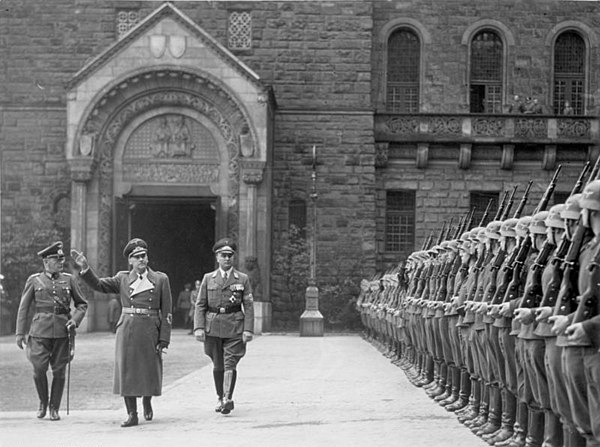 Reviewing the troops in Poznań, November 1939. Greiser is on the right with Wilhelm Frick (center) and Generalmajor Walter Petzel (left).