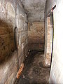 One of the barrack hallways with an entry point to the innermost chamber on the right hand side.