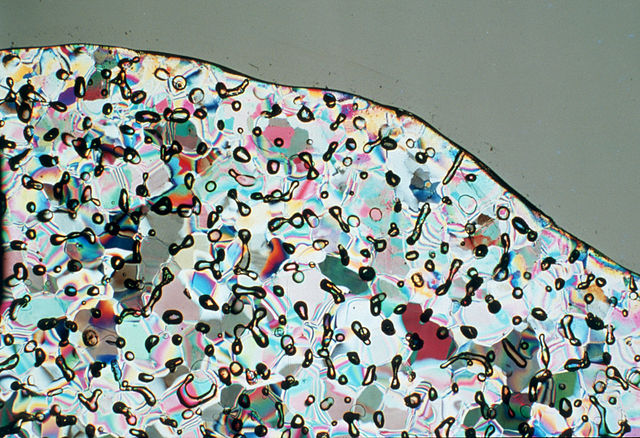 Bubbles in an Antarctic ice sample. Illuminated with polarised light