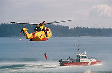 A Royal Canadian Air Force CH-149 Cormorant exercising with a Canadian Coast Guard vessel Canada Search and Rescue.jpg