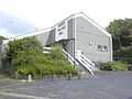 Village Hall, on the east bank.