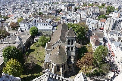 The church seen from above, from the dome of the Basilica of Sacre Coeur. The Cemetery of Calvary is to the right of the church.