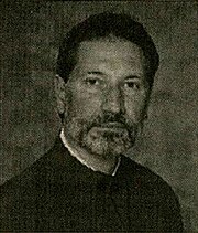 a black-and-white photograph of a priest-monk