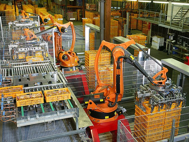 Automated palletizer of bread with industrial KUKA robots at a bakery in Germany