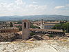 View of city rooftops and surrounding countryside from Piazza Pensile