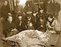 Last moment of Hidesaburō Ueno's partner Yaeko Ueno (front row, second from right) and the station staff in mourning with the deceased Hachikō in Tokyo on March 8, 1935.