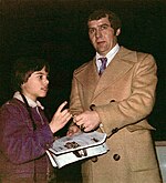 Sinden signing an autograph for a fan following a game at Boston Garden in 1975 Harry Sinden and young hockey fan at Boston Garden (April 1, 1975)retusche.jpg