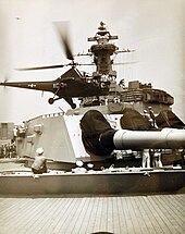 A helicopter lands on a Missouri gun turret during the 1948 Midshipmen's Practice Cruise Helicopter lands on USS Missouri (BB-63) gun turret, 1948 Midshipmen's Practice Cruise (37781879662).jpg