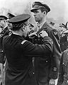 Lt. Gen. Valin, Chief of Staff, French Air Force, awarding Croix De Guerre with palm to Col. James Stewart.