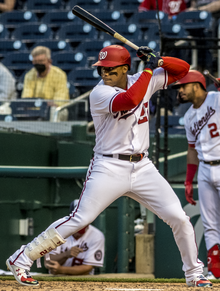 Juan Soto, moments before delivering an RBI single to walk off the Atlanta Braves on April 6, 2021. Juan Soto sets up with two men on and no outs in the bottom of the ninth from Nationals vs. Braves at Nationals Park, April 6th, 2021 (All-Pro Reels Photography) (51101670597) (cropped).png