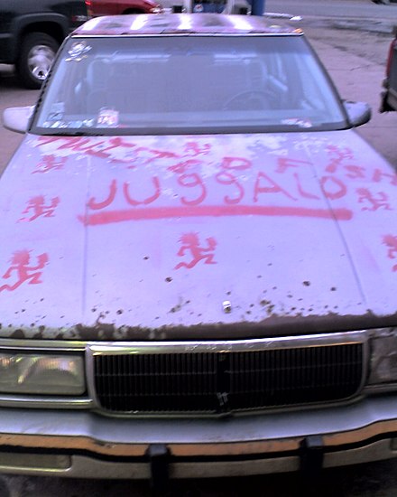 A car painted with a reproduction of the Psychopathic Records logo and the word juggalo