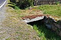 Stone deck bridge over a ditch