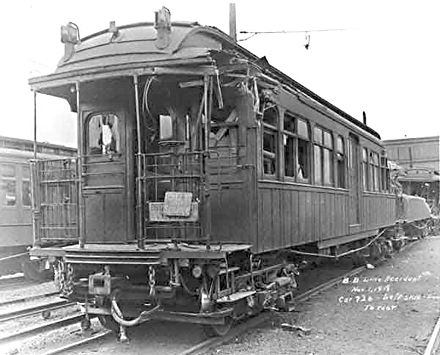 The train involved in the wreck sits in the 36th-38th Street Yard after salvage. Lead car 726 (in front) bore relatively light damage. Nearly demolished car 100 is behind it. MalboneStreetWreck2.jpg