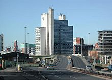 UMIST's Mathematics and Social Sciences building seen from the Mancunian Way with original UMIST logo Mancunian Way UMIST.jpg