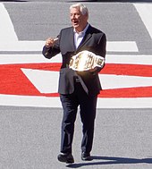 Inaugural champion Pat Patterson, shown here with the 2011-2019 belt design Patterson IC belt.jpg