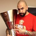 Pero Antić holding Olympiacos 2013 back-to-back Euroleague trophy