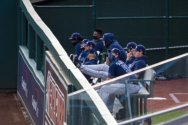 "Bullpen" can be used to describe the area in which these Tampa Bay Rays relief pitchers are sitting or as a metonym for the pitchers themselves.